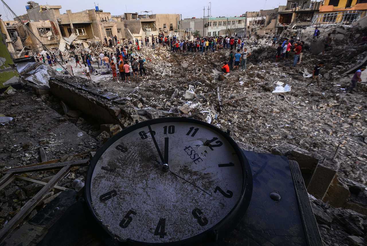 Iraqis inspect the site of an explosion in Baghdad's Sadr City district, Iraq, 07 June, 2018. At least 18 people were killed and over 100 wounded after two powerful blasts targeted a munitions store at a Shiite mosque.